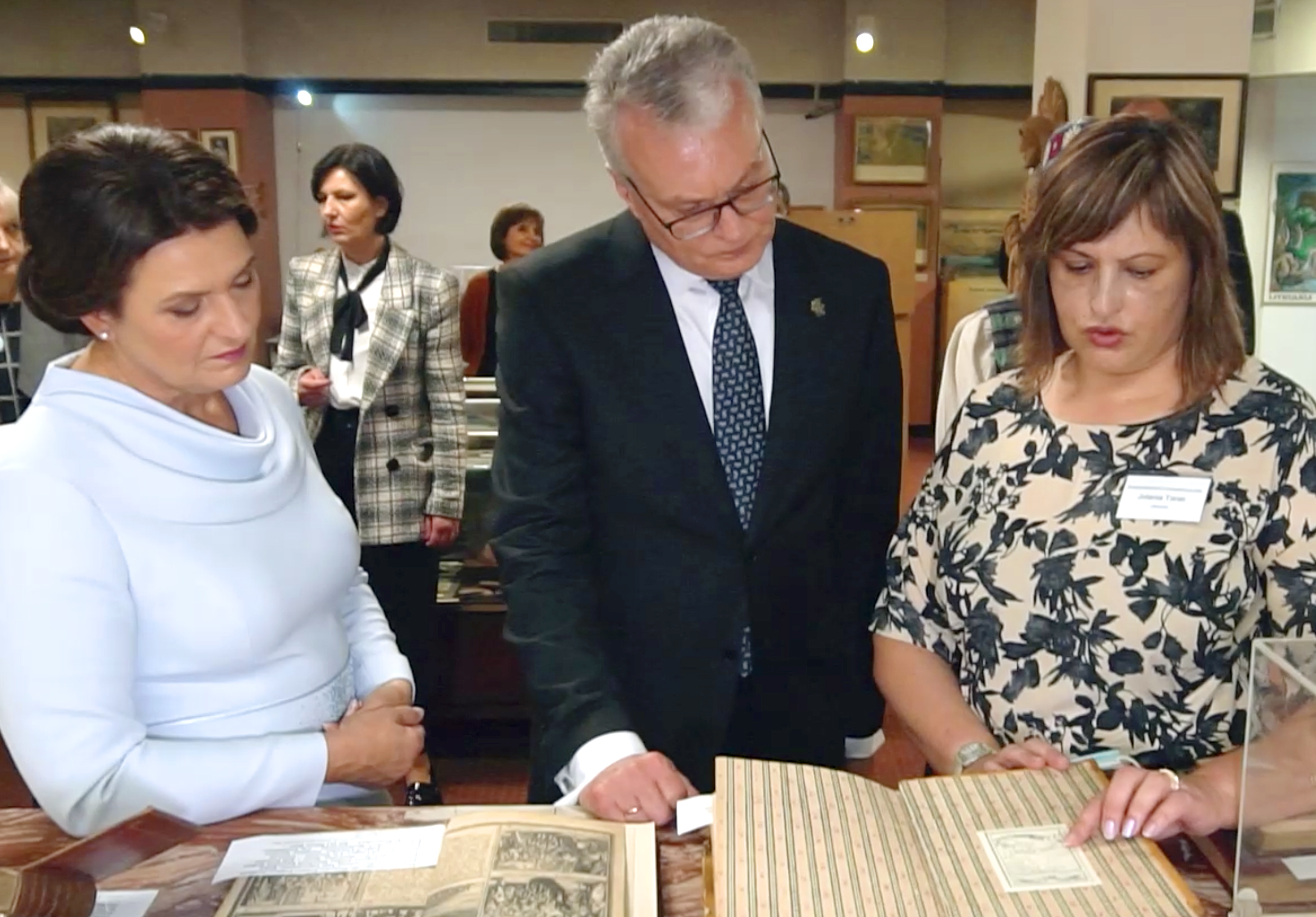 During their 2021 visit to the Museum, First Lady Dalia Nausėdas and Lithuanian President Gitanas Nausėda, a self-professed bibliofile and rare book collector, are shown examples of rare books from the Museum's Library by librarian Jolanta Taras.