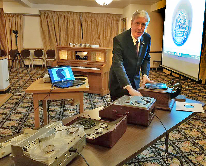 At a 2018 presentation about the Museum's Music Collection, musicologist Dr. Darius Kučinskas demonstrated how to operate early phonographs and other 20th century devices from the Museum's own collection of antique and vintage musical technology. In the background is the museum's pianola player.